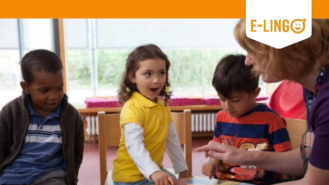 Several children and a teacher look at materials